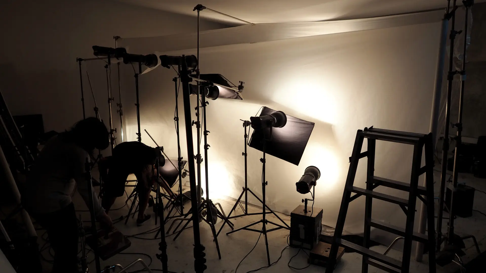 Professional lighting equipment arranged inside a film production studio