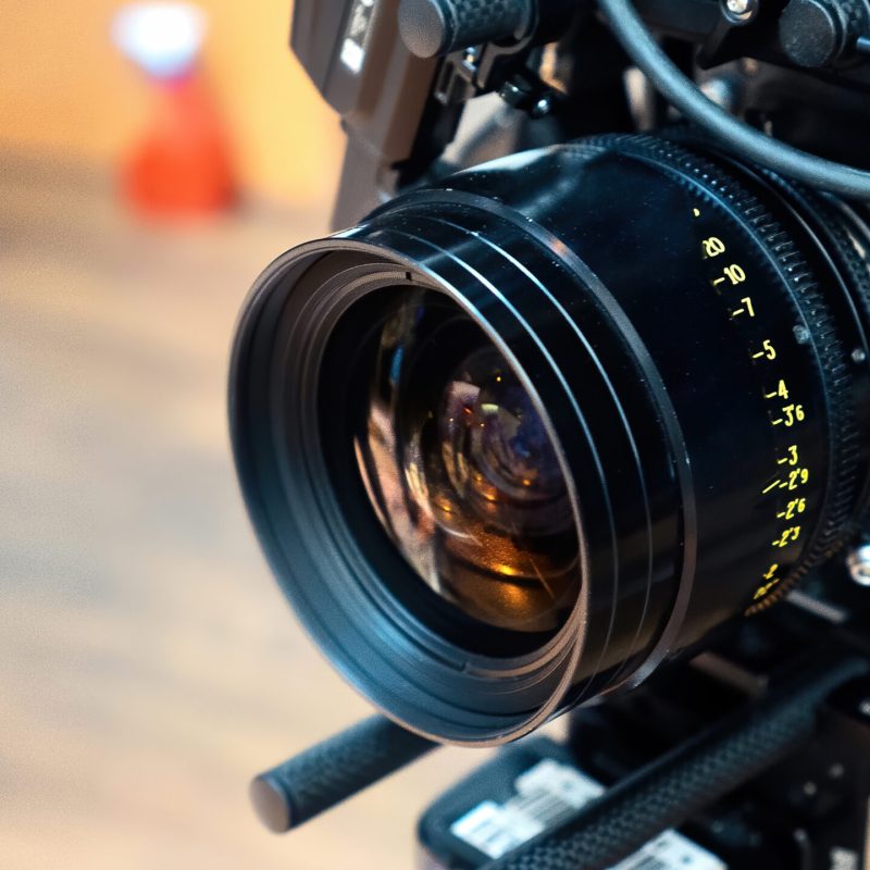 Close-up of professional cinema camera lens used for filmmaking and video production