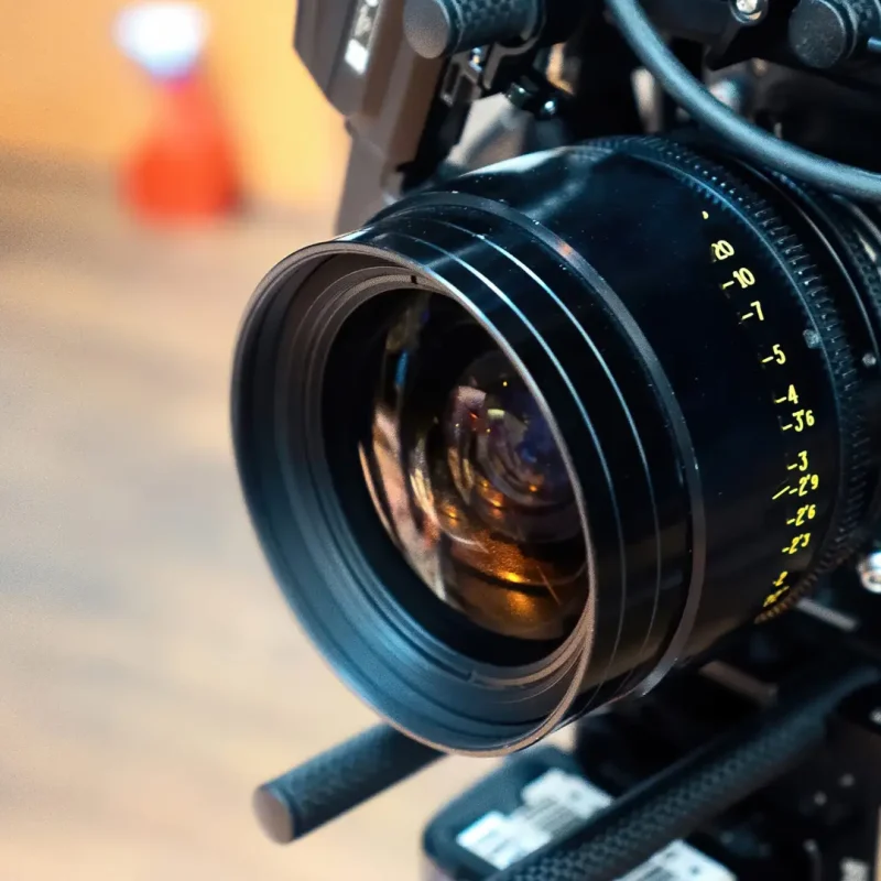 Close-up of professional cinema camera lens used for filmmaking and video production